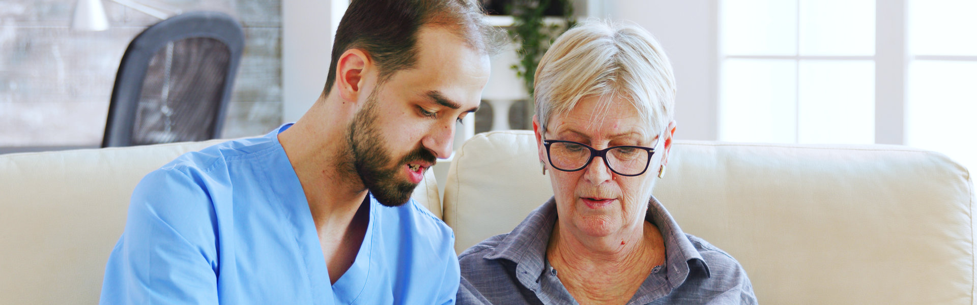 caregiver and elderly woman talking